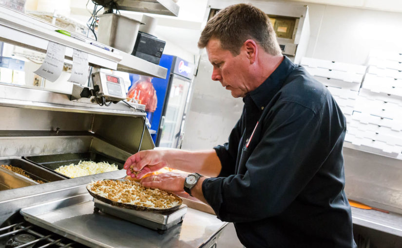 Owner Making Pizza